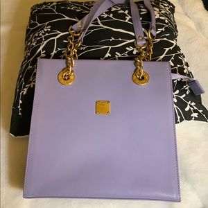 Lavender MCM bag w/ gold chain accent straps